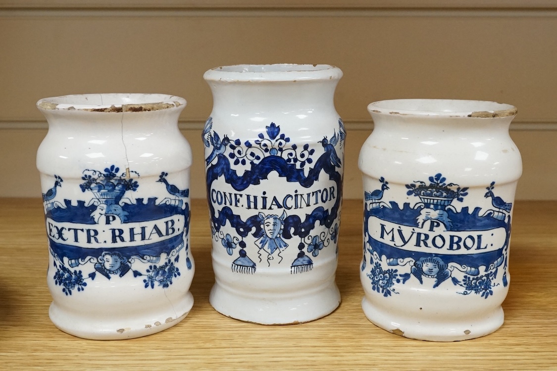 Three 18th century Delft blue and white drug jars; extract of rhubarb, Myrobol, and Conf. Hiacintor, largest 14cm high
